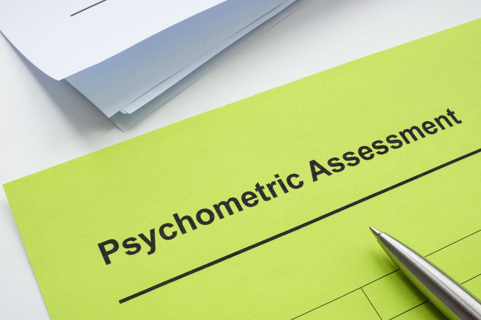 Psychometric assessment form, pen and papers.
